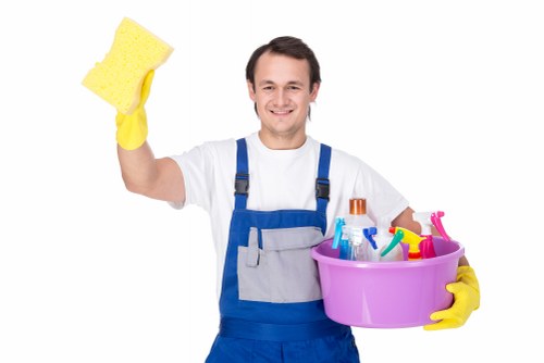 Domestic cleaning team in N1 preparing a tidy living room