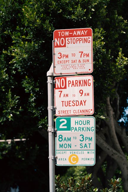 A round, blue and red no-parking traffic sign mounted on a metal pole, casting a distinct shadow on a textured brick wall background. The wall is composed of irregular beige, brown, and gray stones wi